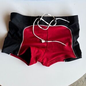 AUSSIEBUM Red & Black Swim Trunks. Made in Australia. 80% Nylon. 20% Lycra.